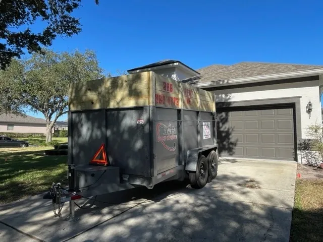 A dump trailer placed at a residential property.